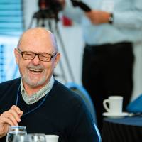 man smiling at dinner
